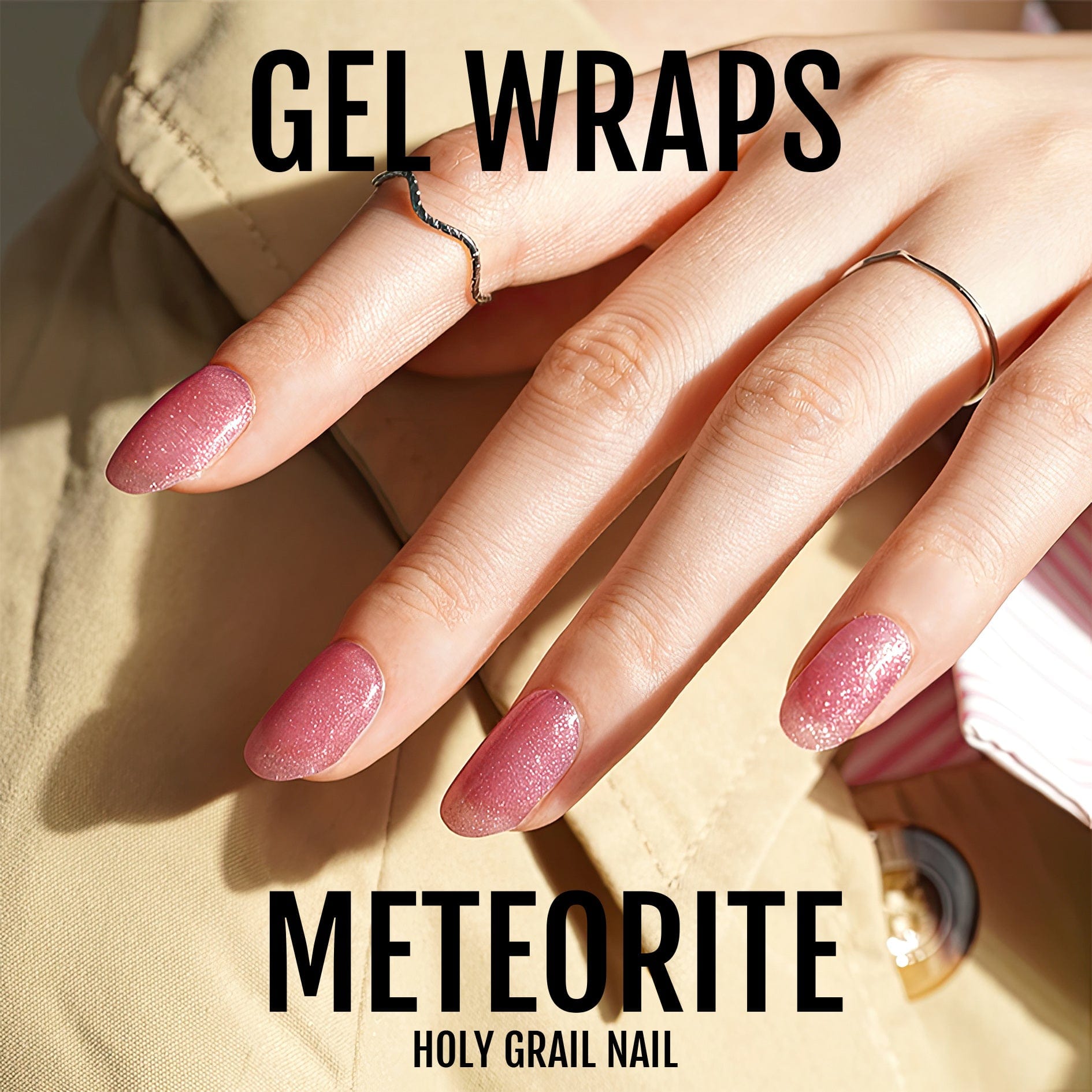 Hand wearing mauve purple glittery gel nail wraps with sparkle finish for at-home manicure