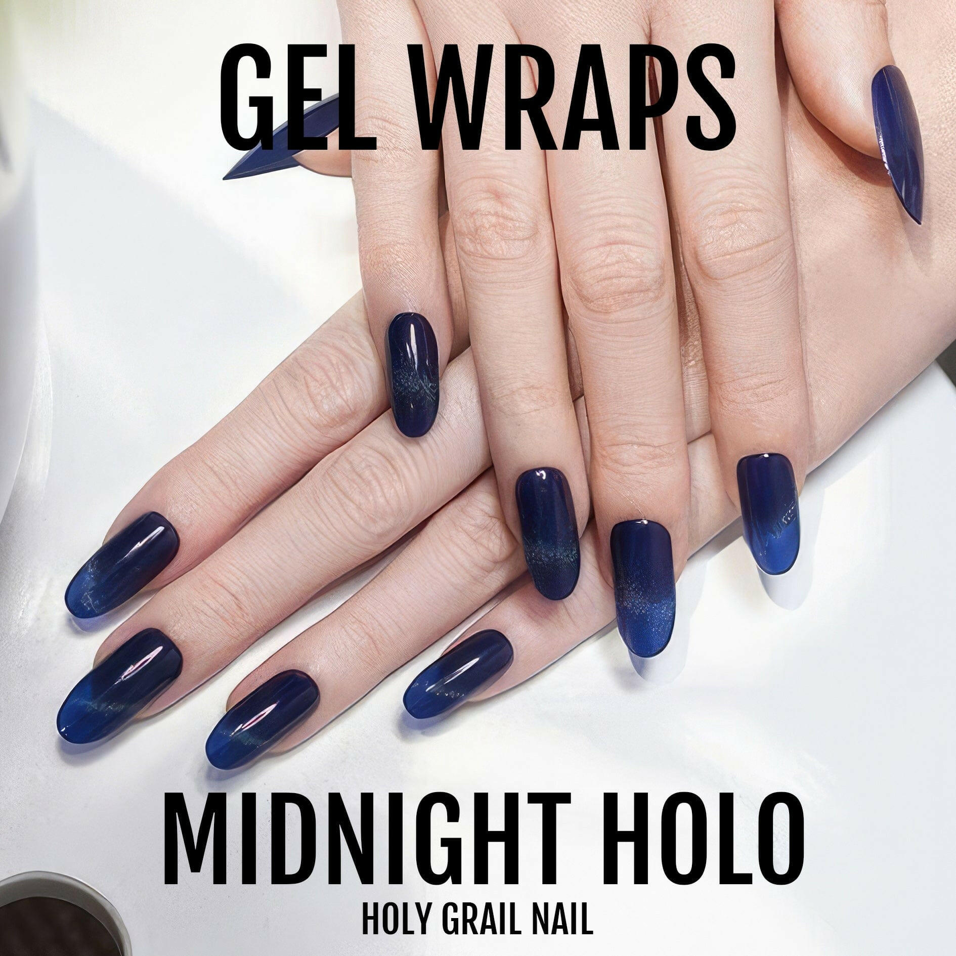 Dark navy holographic gel nail wraps on hand showing midnight blue shimmer finish
