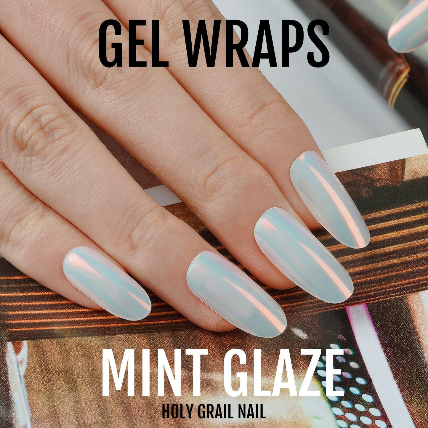 Mint glazed gel nail wraps with iridescent finish on manicured hand