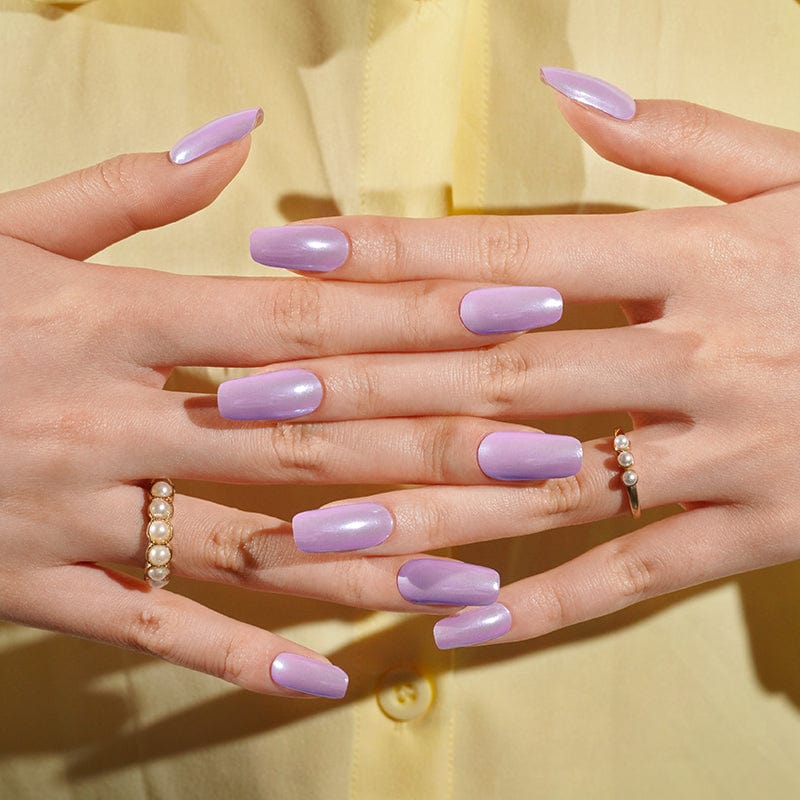 Purple iridescent gel nail wraps displayed on both hands showing reflective chrome finish