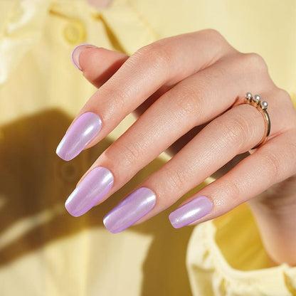 Lilac chrome gel nails on hand with high-shine metallic finish and ring jewellery