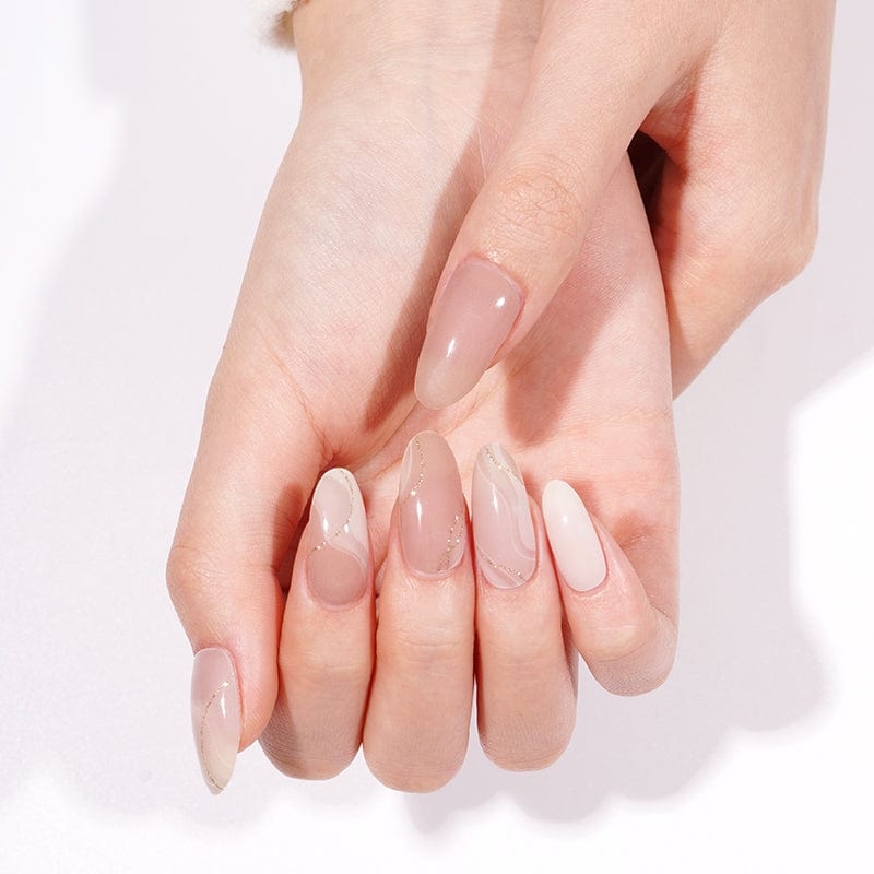 Nude pink marble gel nail wraps on hands showing glossy shimmer finish