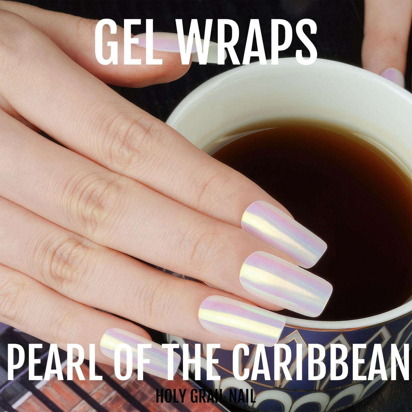 Hand holding coffee cup showcasing iridescent pearl gel nail wraps with holographic rainbow finish