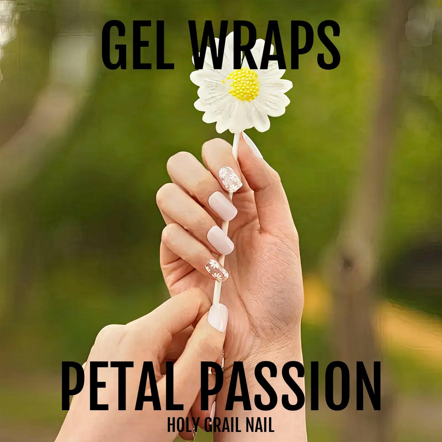 Hand holding white daisy wearing pink gel nail wraps with floral nail art design