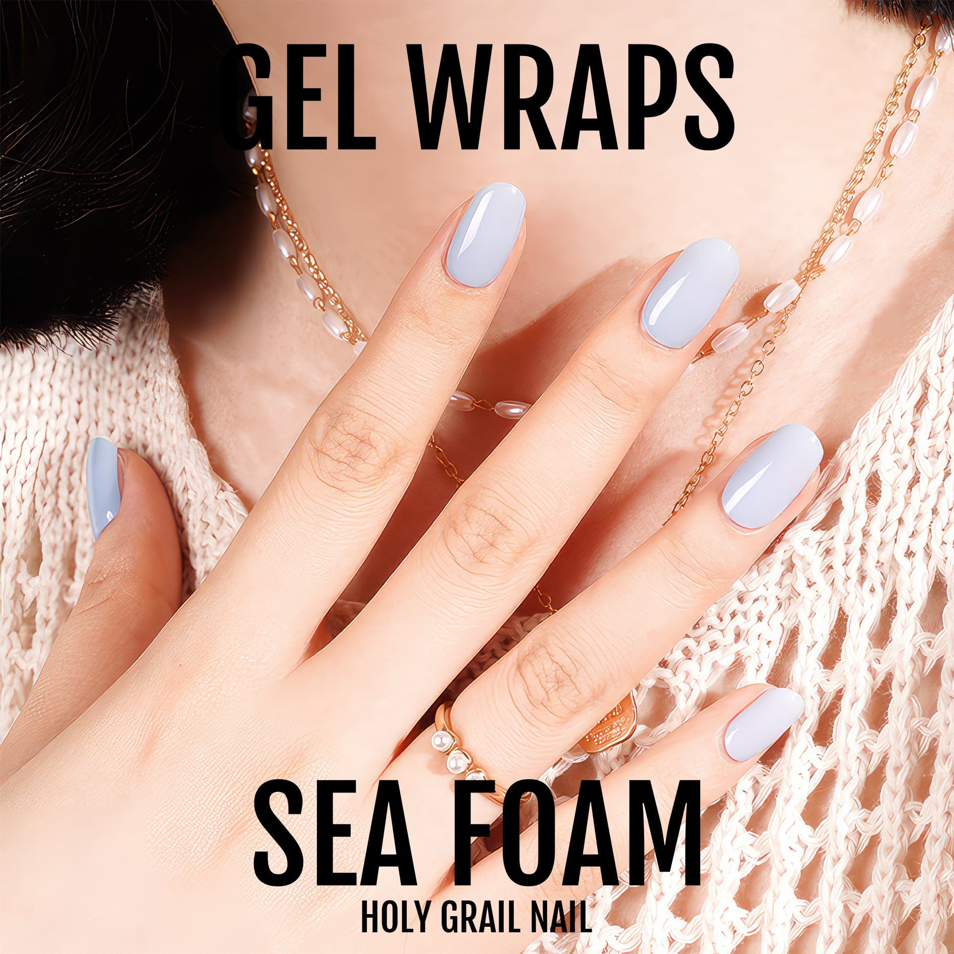 Soft blue gel nail wraps displayed on hand with delicate chain jewellery