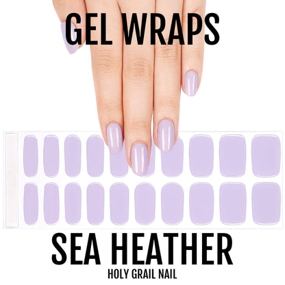 Lavender purple gel nail wraps on hand showing glossy manicure finish