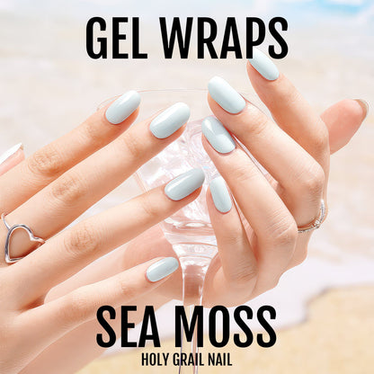 Sea moss blue gel nail wraps displayed on hands with glossy powder blue finish