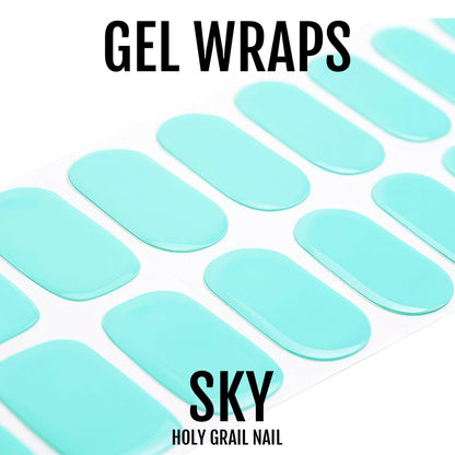 Turquoise gel nail wraps in glossy finish arranged on white background for at-home manicure