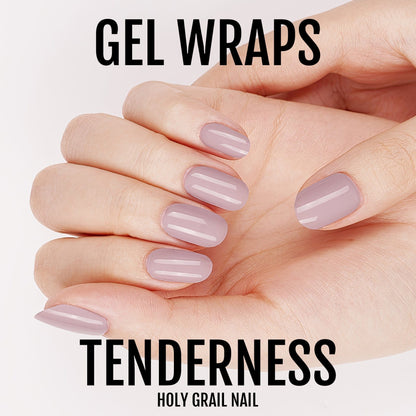 Hand displaying mauve pink gel nail wraps in oval shape for professional at-home manicure
