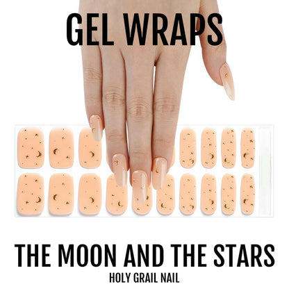 Semi-cured gel nail wrap sheets in peachy nude with metallic gold moon star patterns