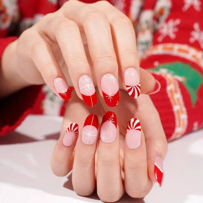 Festive Christmas gel nail wraps featuring red French tips and white snowflake nail art