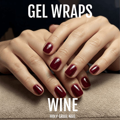 Wine red gel nail wraps on both hands showing deep burgundy glossy manicure