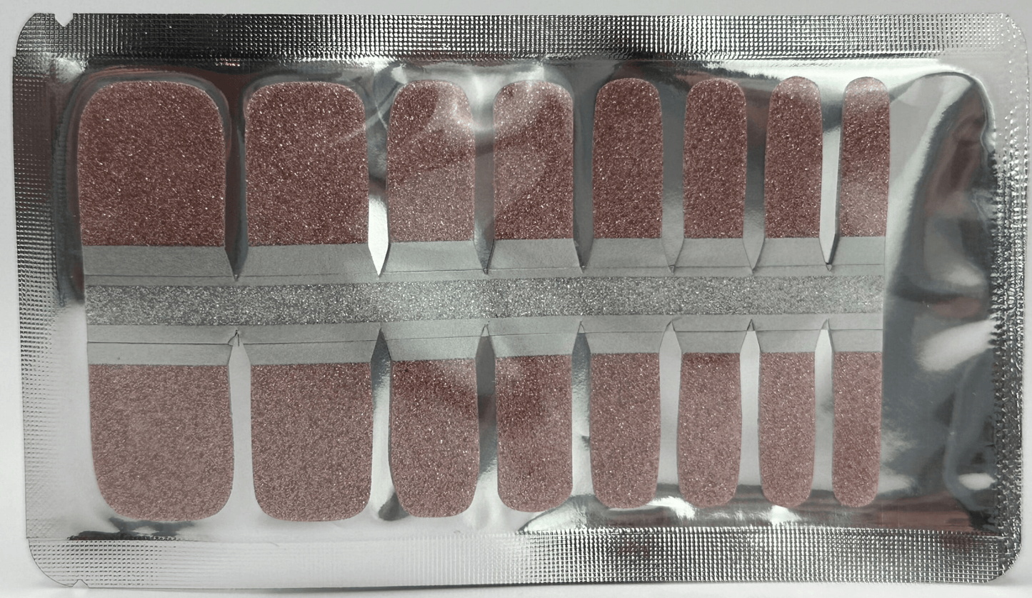 Pink glitter pedicure nail wraps in packaging for at-home foot manicure